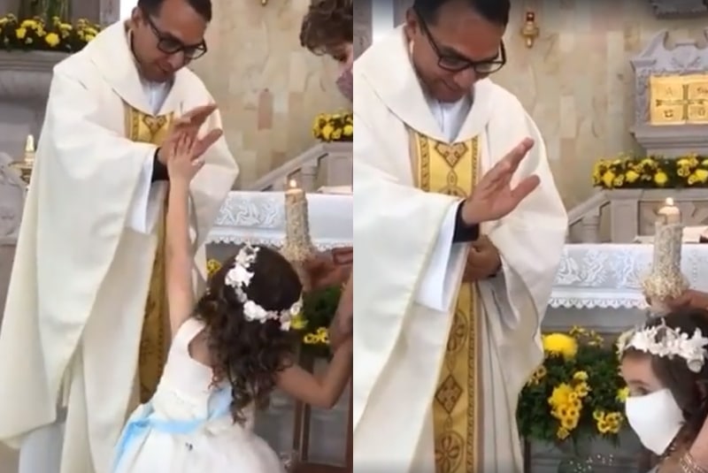 Niña confunde bendición de padre con choque de manos (+video). Noticias en tiempo real