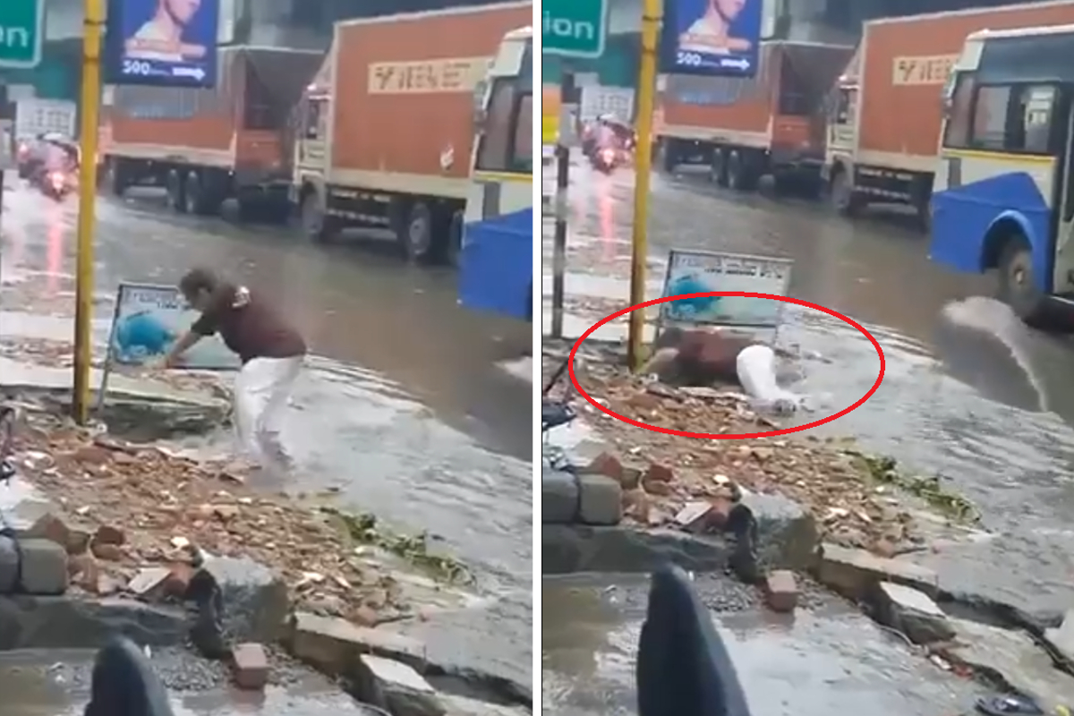 Hombre es es arrastrado por coladera en calle inundada.