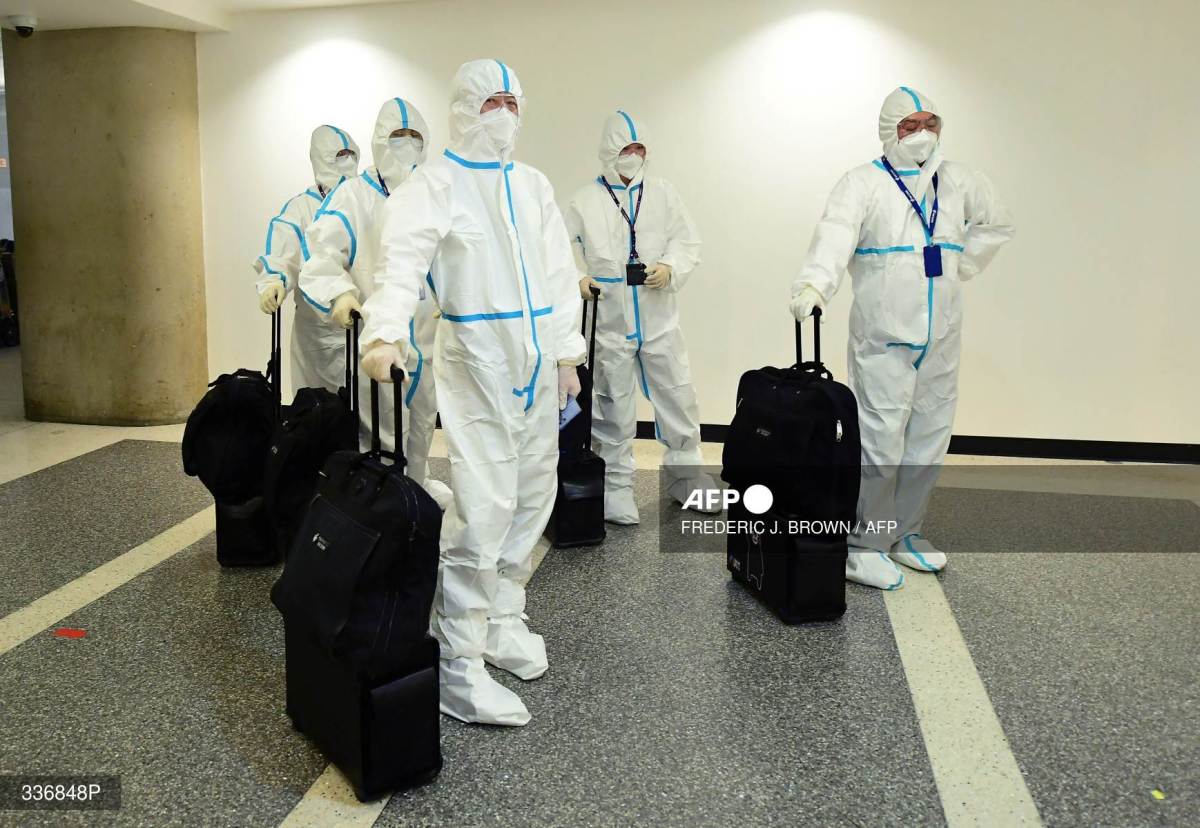 Foto: AFP | El gobierno chino anunció que eliminaba la exigencia de cuarentena para visitantes del exterior. anticovid