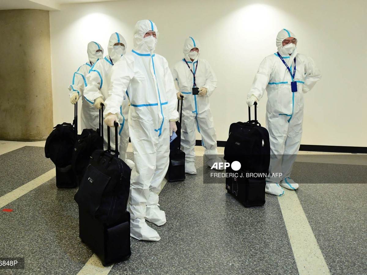 Foto: AFP | El gobierno chino anunció que eliminaba la exigencia de cuarentena para visitantes del exterior. anticovid