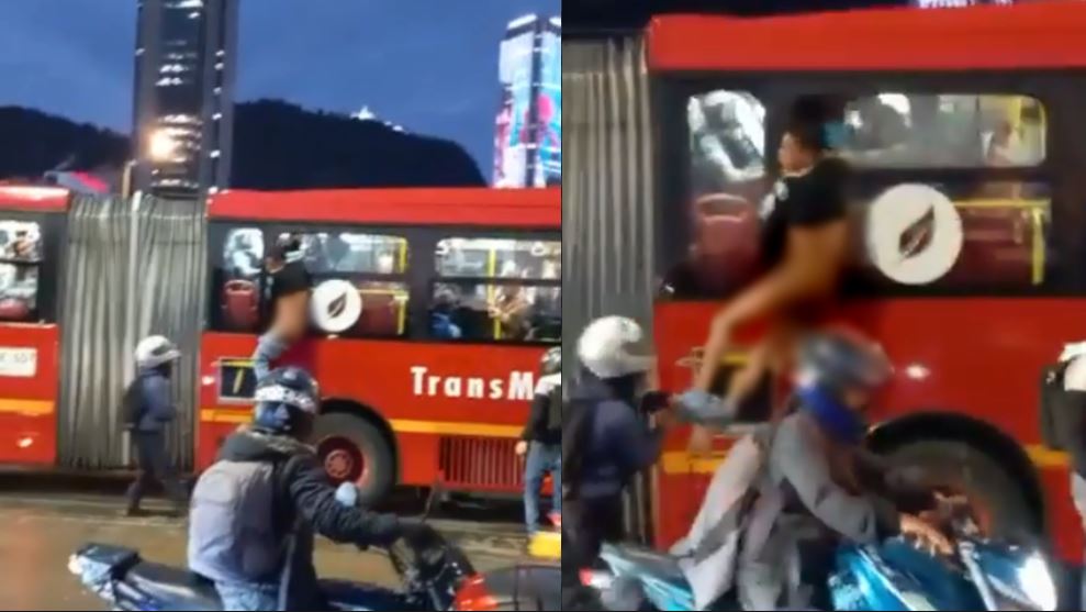 come down!  Passengers catch thief on bus and hangs from window without pants