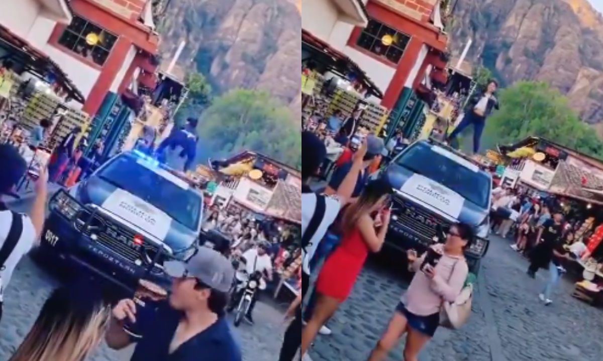 Foto:Captura de pantalla|VIDEO: Tunden a mujer por bailar encima de una patrulla en Tepoztlán